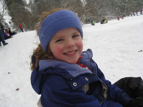 Abby smiles sledding 2010